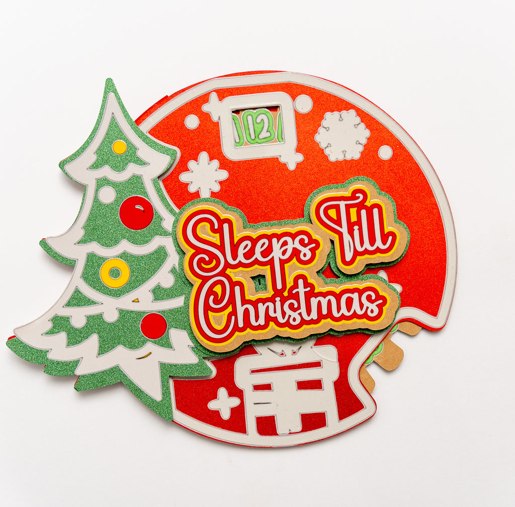 Christmas countdown ornament with tree, stocking, and 'Sleeps Till Christmas' text on a white background